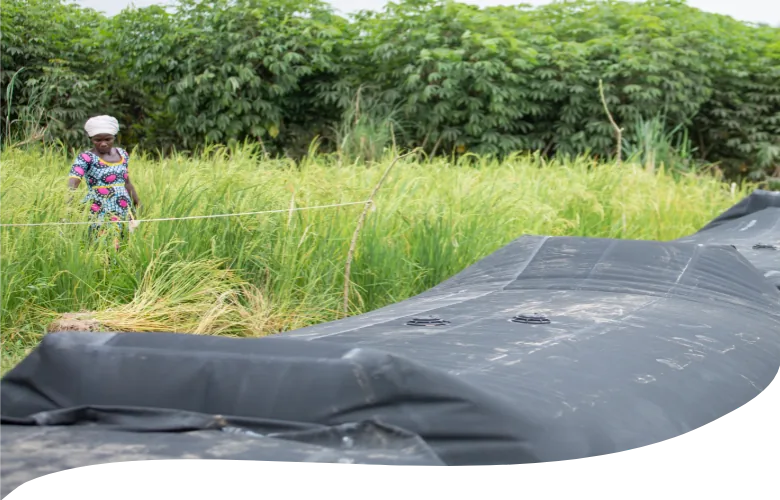SLAMDAM flood barrier laid out in tall grass