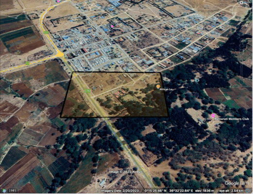Aerial view of a semi-urban area with roads, buildings, green spaces, and a highlighted rectangular plot labeled “African Law” near the C76 road.