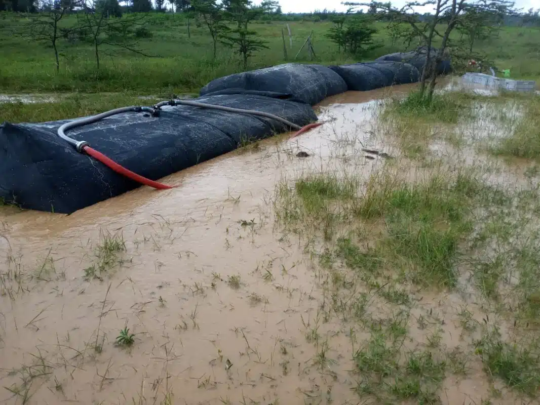 SLAMDAM barriers holding back muddy floodwater in Ngusishi, Kenya